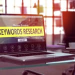 Laptop Screen with Keywords Research Concept. video seo keyword planning