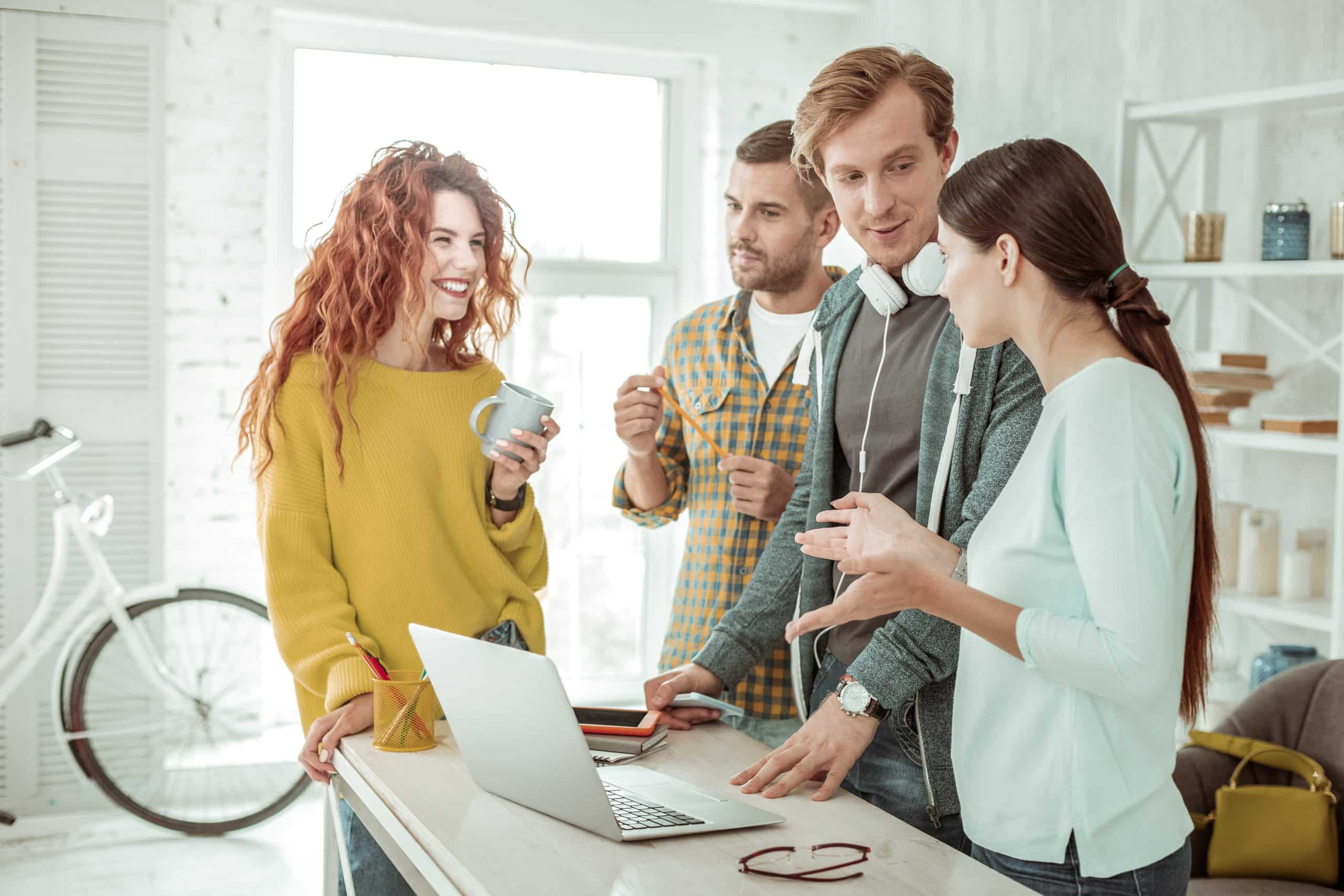 Young-professionals-using-video-captions-while-talking-about-work-video-over-computer