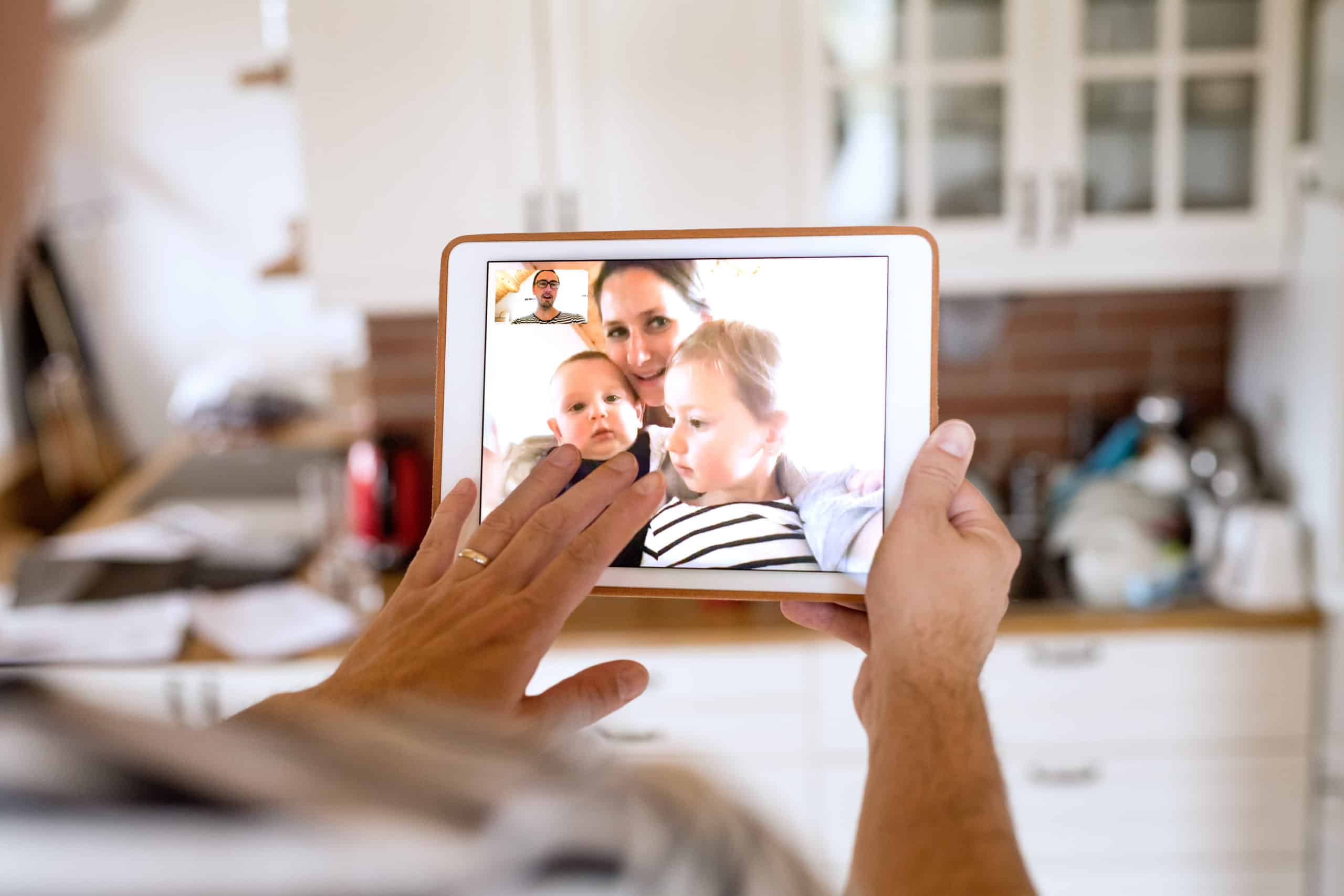Father Using Video To Stay In Touch With Family