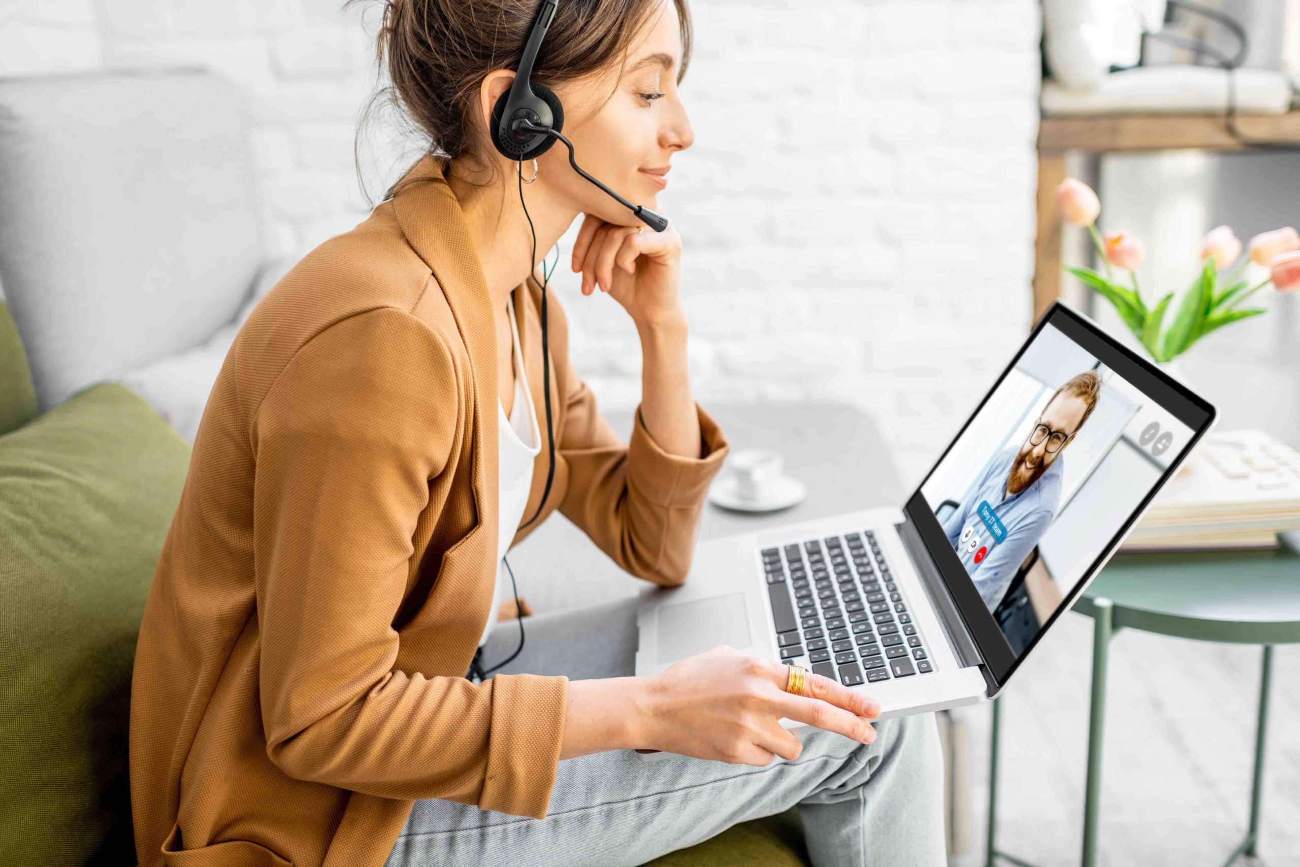 Women on video conference with laptop and headset