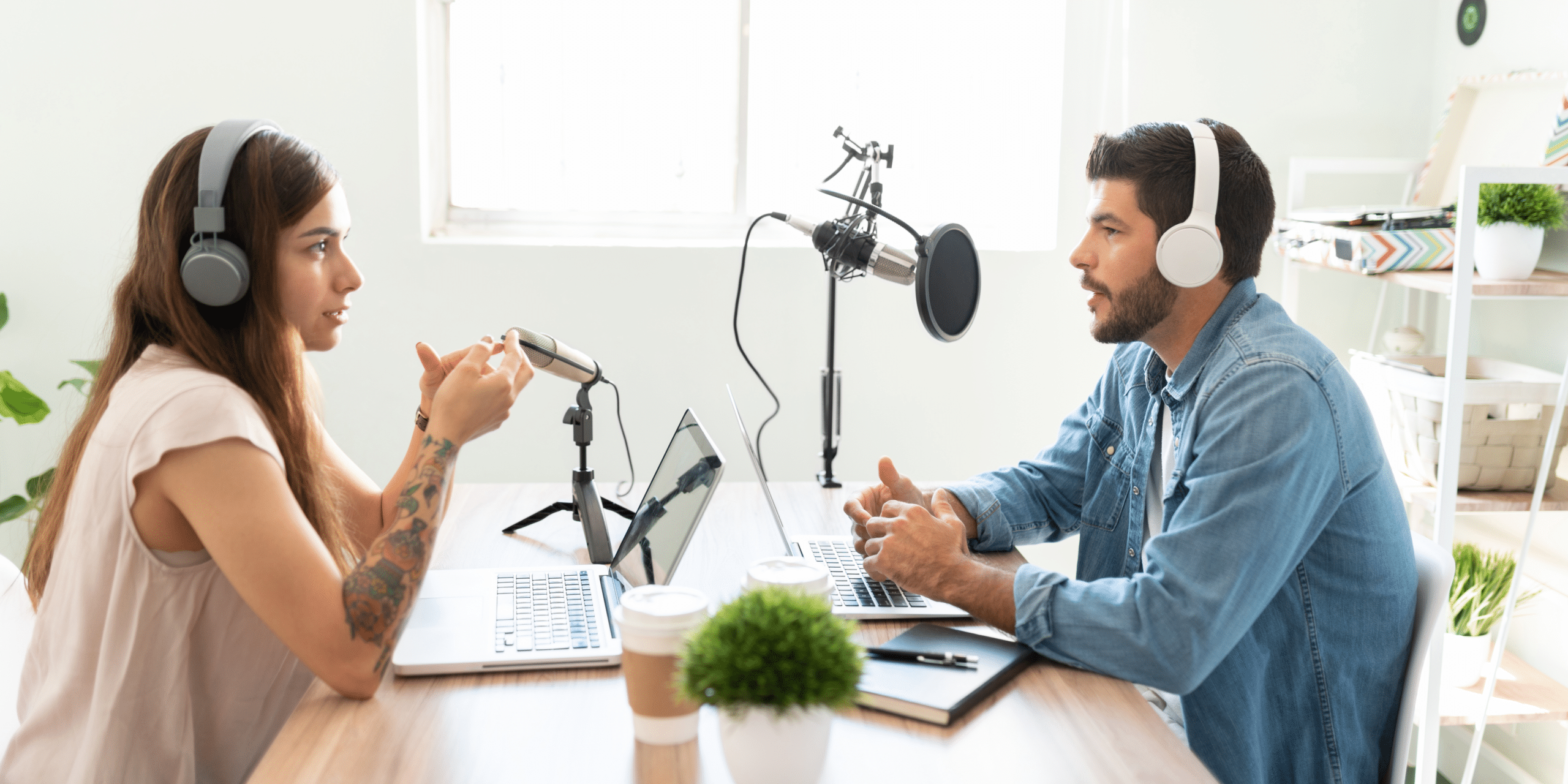 Two people recording a podcast