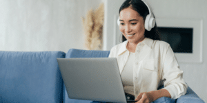 Woman With Headphones And Laptop
