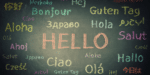 "Hello" written in different languages on a chalkboard